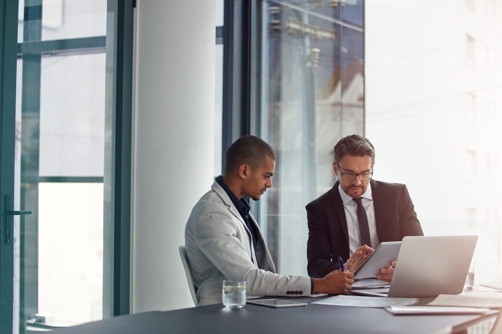 A couple working through their property investment strategy with a Chase Wealth Australia adviser