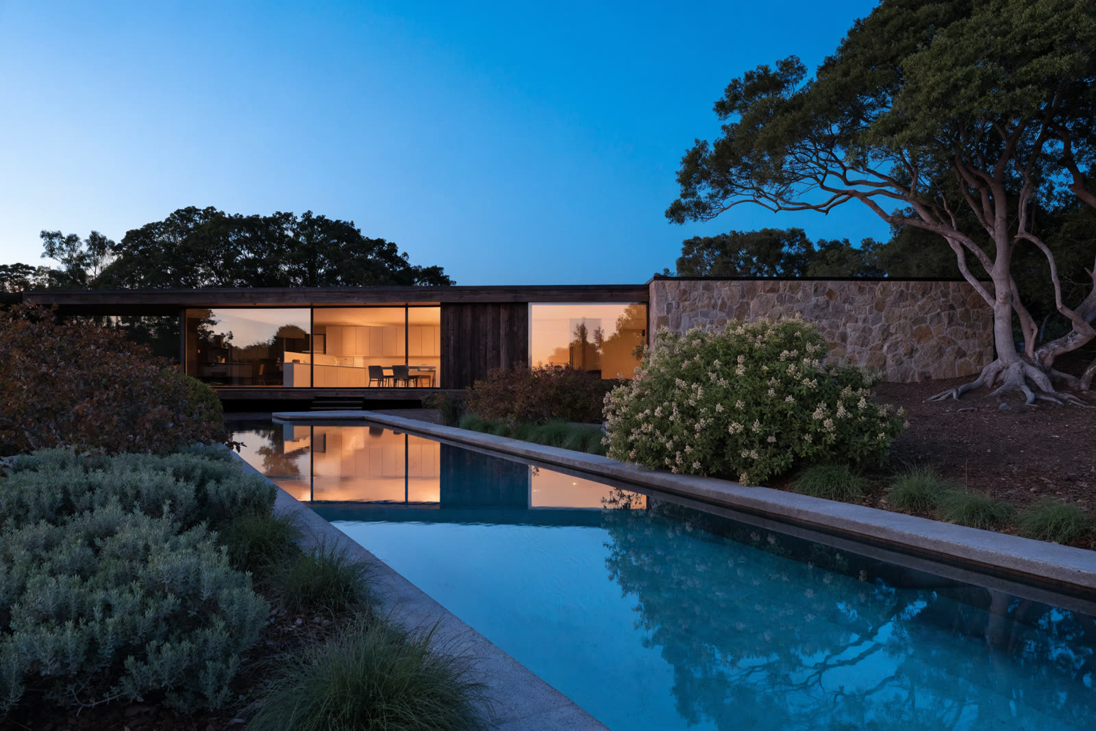 Premium Australian home at dusk representing built property wealth